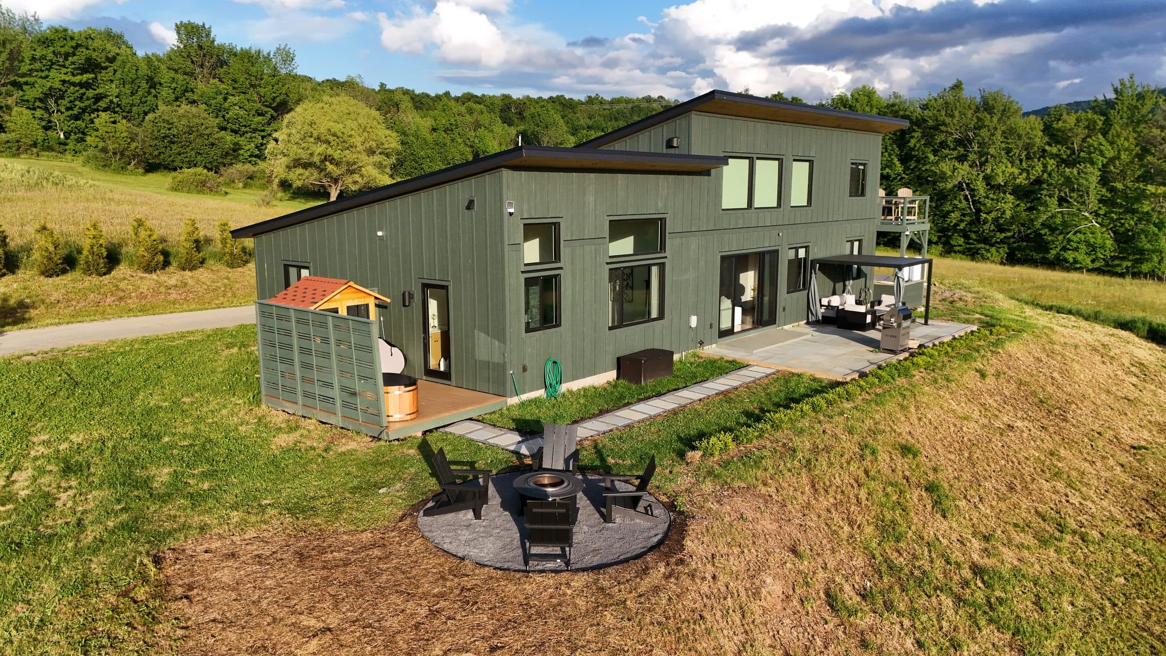 Aerial of the house and sixteen acres at golden hour