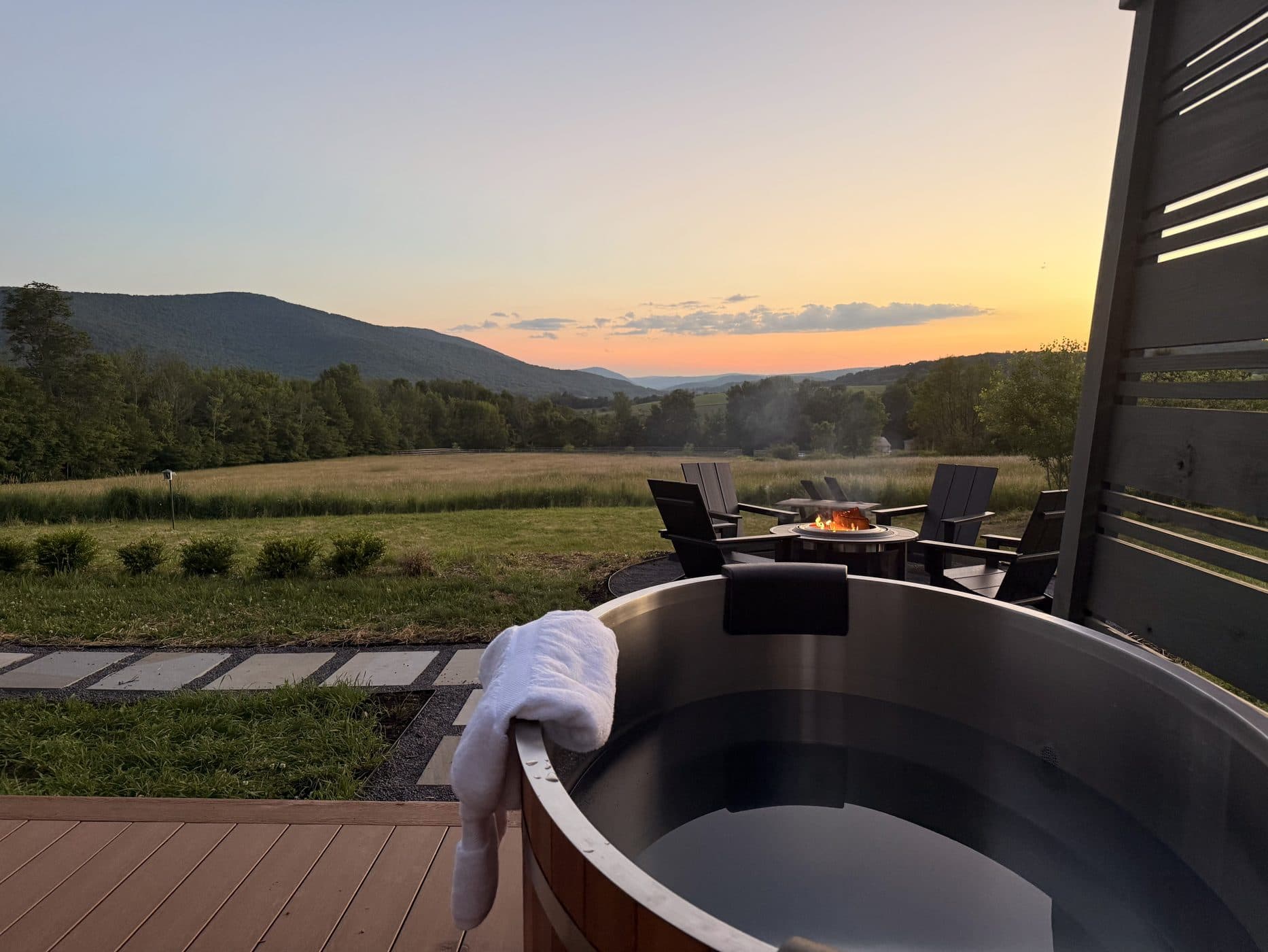 The back deck and cold plunge at sunset, ridge beyond