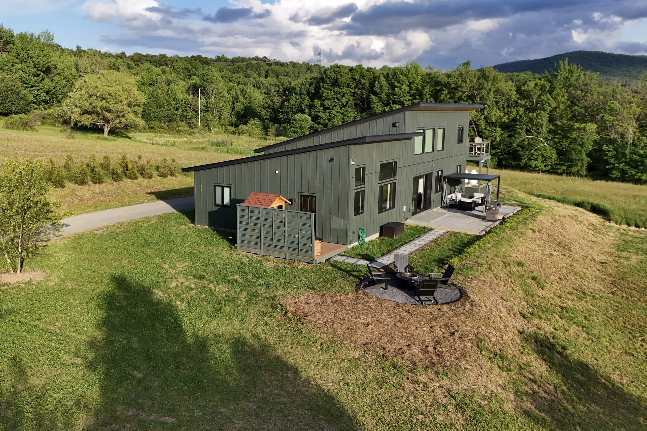 The property from directly above — house, drive, and fields